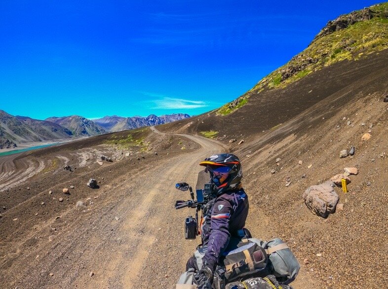 Riding over volcanic sediments on the Chile side of Paso Pichachen