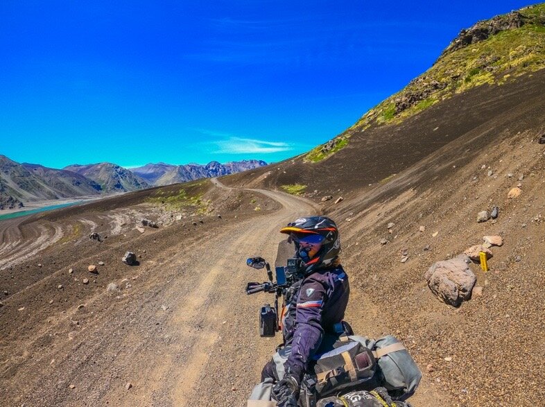 Riding over volcanic sediments on the Chile side of Paso Pichachen